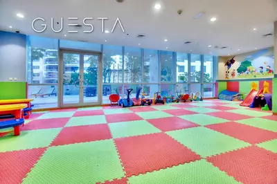 a childrens play room with a checkered floor at The Waves by DAMAC, Dubai Marina in Dubai
