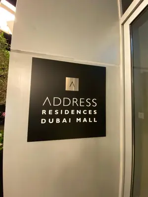 a sign on the side of a door with a sign for a dress residence d at Address Dubai Mall Fashion Avenue 1 bedroom 34 floor in Dubai