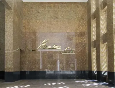 a building with a sign on the side of it at Frank Porter - Mon Reve in Dubai