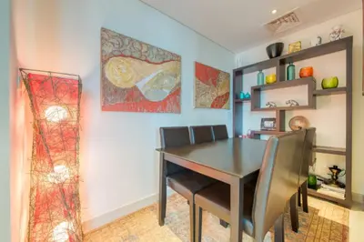 a dining room with a black table and chairs at Close to Burj Khalifa & Dubai Mall with Relaxing Balcony, Claren Tower 1, Downtown Dubai by Deluxe Holiday Homes in Dubai