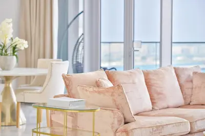 a living room with a couch and a table at Contemporary and Spacious 2 BR in Bluewaters Island in Dubai