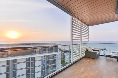 an apartment balcony with a view of the ocean at Posh 2 BR Oceanfront Apt in the Heart of Bluewaters Island in Dubai