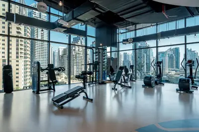 a gym with a view of a city skyline at HiGuests - Unique Studio With Stunning Panoramic Marina Views in Dubai