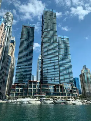 a group of tall buildings with boats in the water at Jumeirah Living Marina Gate in Dubai