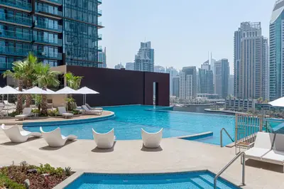 a pool on the roof of a building at Jumeirah Living Marina Gate in Dubai