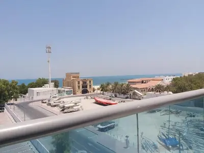 a view of a swimming pool from a balcony at Beach Walk Hotel Jumeirah in Dubai