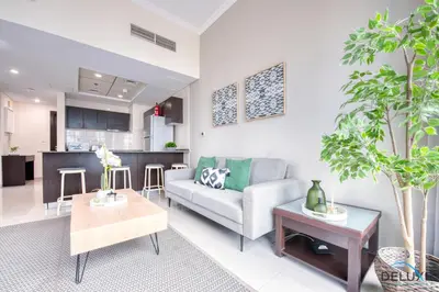 a living room with a couch and a table at Overlooking Marina Canal 1BR Close to Mall, Promenade & Beach, Bay Central 1, Dubai Marina by Deluxe Holiday Homes in Dubai