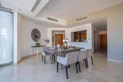 a dining room with a table and chairs at Frank Porter - Trident Grand in Dubai