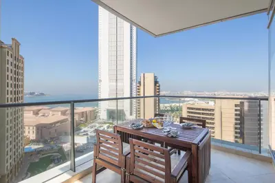 a balcony with a table and two chairs on a building at Frank Porter - Trident Grand in Dubai