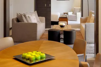 a table with a plate of fruit on top of it at Hotel Boulevard, Autograph Collection, Downtown Dubai in Dubai
