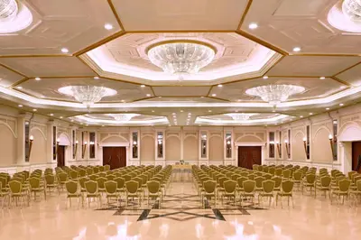 a large banquet hall with chairs and chandeliers at Al Habtoor Grand Resort, Autograph Collection in Dubai