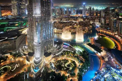 an aerial view of a city at night at Spacious 3BR in Downtown, Direct Access to Dubai Mall & Metro, Burj Khalifa Views in Dubai
