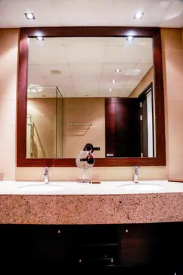 a bathroom with two sinks and a large mirror at Luxe Getaways Royal Amwaj Palm Jumeirah Resort Apartment Holiday Home in Dubai