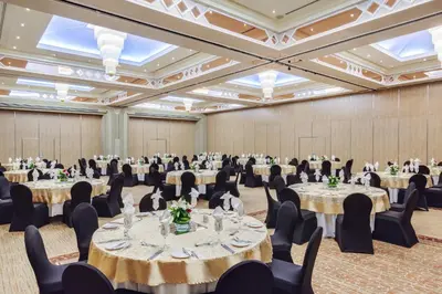a large banquet hall with tables and chairs at Millennium Plaza Downtown, Dubai in Dubai