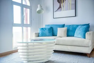 a living room with a couch and a coffee table at The Smart Concierge - Discovery Gardens street 4 in Dubai
