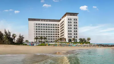 a hotel on the beach next to the beach at Rove La Mer Beach, Jumeirah in Dubai