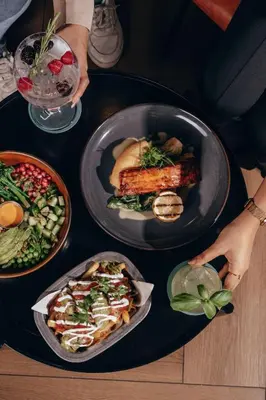 a table with plates of food on a table at Radisson Blu Hotel, Dubai Media City in Dubai