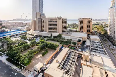 an aerial view of a city with tall buildings at Sea View Studio 10min from beach Royal Oceanic in Dubai