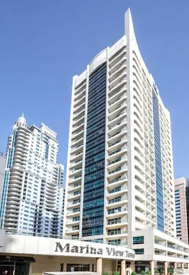 a large white building with a marina way sign on it at Splendid Studio in Marina View Towers in Dubai