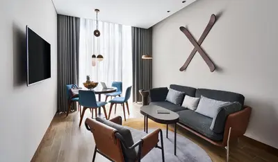 a living room with a couch and a table at Barcelo Business Bay Dubai in Dubai