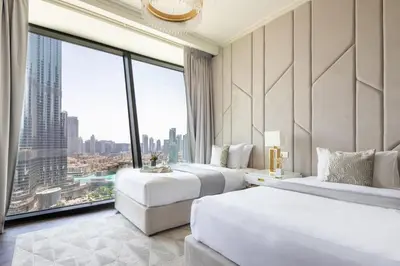 a hotel room with two beds and a large window at Frank Porter - Burj Vista in Dubai