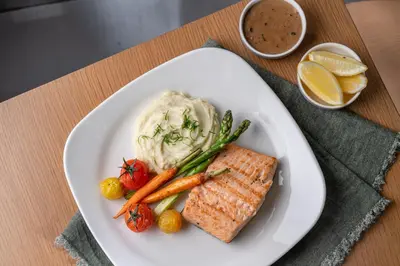 a plate of food with vegetables and dip on a table at Element Al Jaddaf, Dubai in Dubai