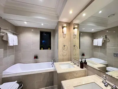 a large bathroom with two sinks and a tub at Durrani Homes - Heaven On Earth- Burj Khalifa Fireworks in Dubai