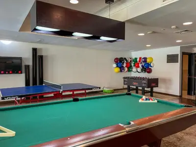 a room with a pool table and ping pong balls at Durrani Homes - Heaven On Earth- Burj Khalifa Fireworks in Dubai