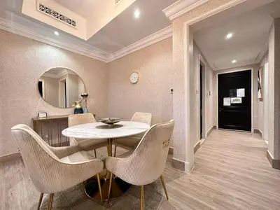a dining room with a table and chairs at Durrani Homes - Heaven On Earth- Burj Khalifa Fireworks in Dubai