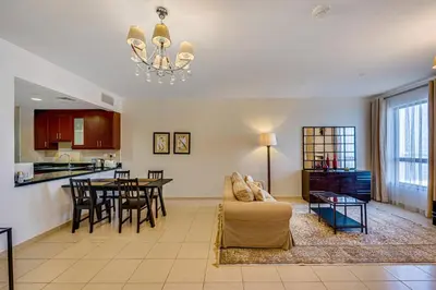 a living room with a couch and a table at Huge Sea View Studio in Murjan JBR in Dubai