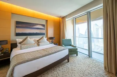 a hotel room with a bed and a large window at Fashion Avenue Dubai Mall-Burj Khalifa by The SHH in Dubai