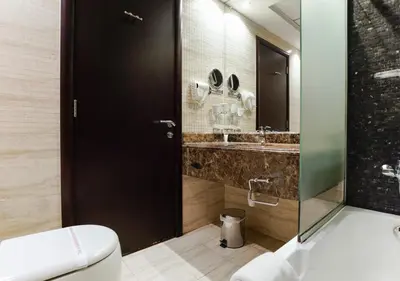 a bathroom with a toilet and a sink at City Stay Residences - Serviced Apartments Al Barsha in Dubai