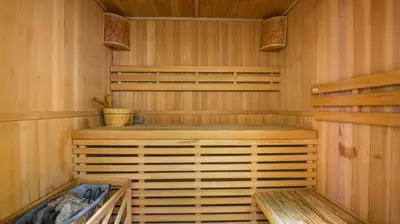a sauna with wood paneled walls and a wooden floor at City Stay Residences - Serviced Apartments Al Barsha in Dubai