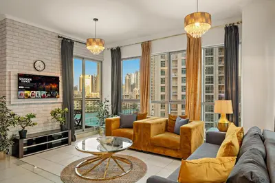 a living room with a couch and chairs and a large window at FIRST CLASS 1BR Spectacular Fountain Views in Dubai