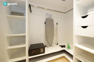 a walk in closet with a shower and a toaster at HiGuests - Fabulous Duplex With Breathtaking Lake Views in Dubai
