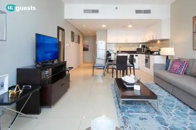 a large living room with a couch and a table at HiGuests - Fabulous Duplex With Breathtaking Lake Views in Dubai