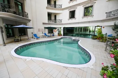 a swimming pool in the middle of a building at Al Waleed Holiday Homes in Dubai