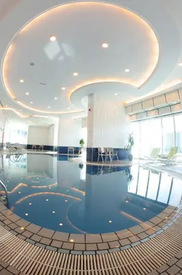 a pool in the middle of a building at Tamani Marina Hotel & Apartments in Dubai