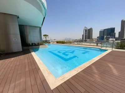 a swimming pool on the roof of a building at RH- Modern Comfort & bright 1BR near Dubai Mall, City Views in Dubai