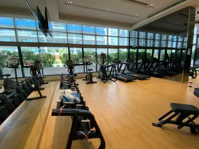 a gym with a lot of treadmills and ellipticals at RH- Modern Comfort & bright 1BR near Dubai Mall, City Views in Dubai