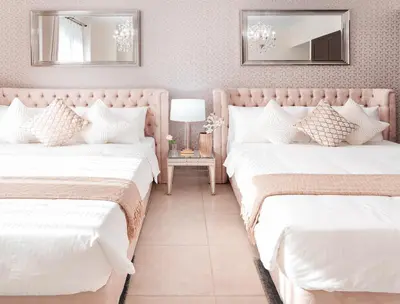 two beds in a room with two mirrors at Elite Royal Apartment - Full Burj Khalifa & Fountain View - Emerald in Dubai