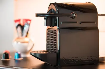 a black toaster sitting on top of a table at Elite Royal Apartment - Full Burj Khalifa & Fountain View - Ruby in Dubai