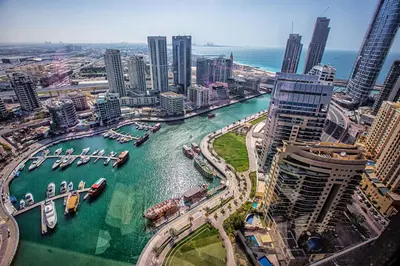 a view of a city with boats in the water at 1BD apt in Sparkle Tower by Swarovsky big capacity in Dubai