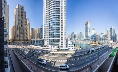 a bridge in a city with cars on it at 1BD apt in Sparkle Tower by Swarovsky big capacity in Dubai