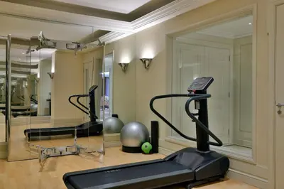 a gym with two exercise bikes and a treadmill at The Westin Dubai Mina Seyahi Beach Resort and Waterpark in Dubai