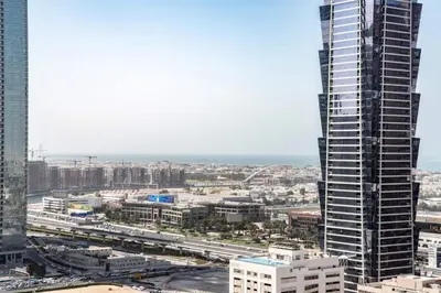 a view of a city with a tall building at Scenic 2 Bedroom Apartment - Downtown Business Bay in Dubai