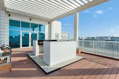 a balcony with a view of a building at Live Modern Live Luxury - Dubai Studio City in Dubai