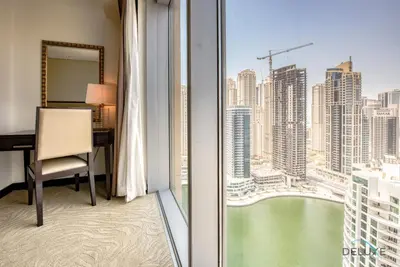 a room with a desk and a view of a city at Exquisite 1BR at The Address Residences Dubai Marina by Deluxe Holiday Homes in Dubai
