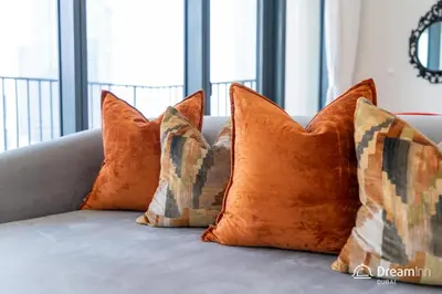 a group of pillows sitting on top of a couch at Dream Inn Apartments- Boulevard Heights in Dubai