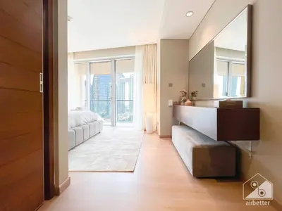 a bedroom with a mirror and a bed in it at Dubai Mall 1Bedroom Balcony in Dubai